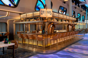 Front view of DR INK Ph.D. bar on Carnival Jubilee, featuring underwater-themed decor with octopus design details.