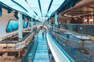Aerial view of Dr. Inks Ph.D. Bar on Carnival Jubilee, showcasing underwater-themed decor and innovative cocktail presentation.